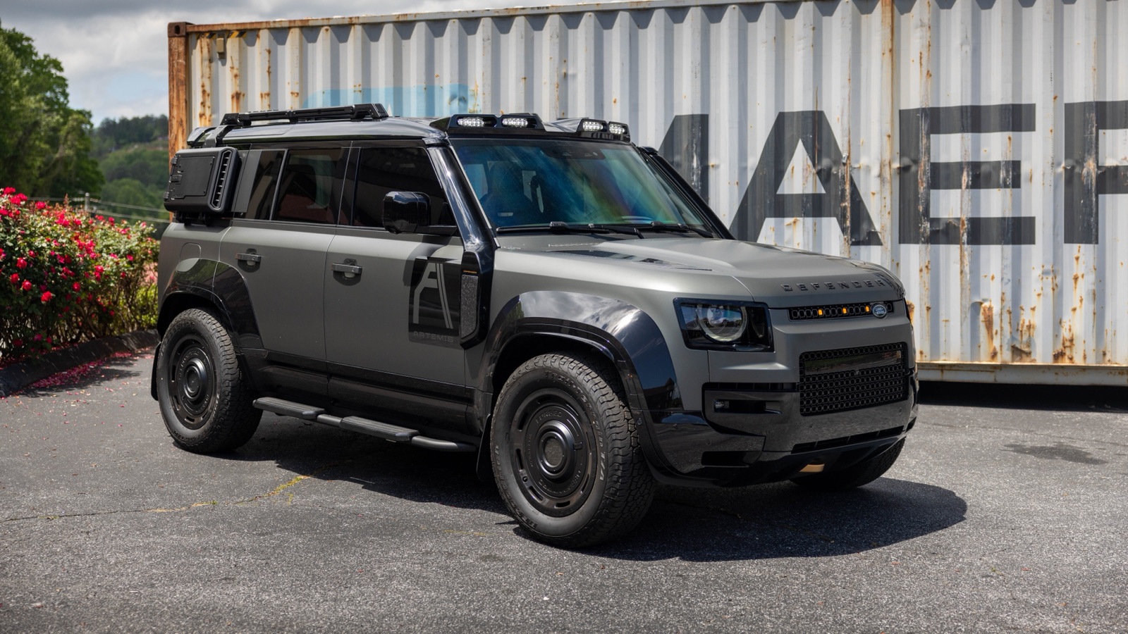 Artemis OCTA Defender by a shipping container